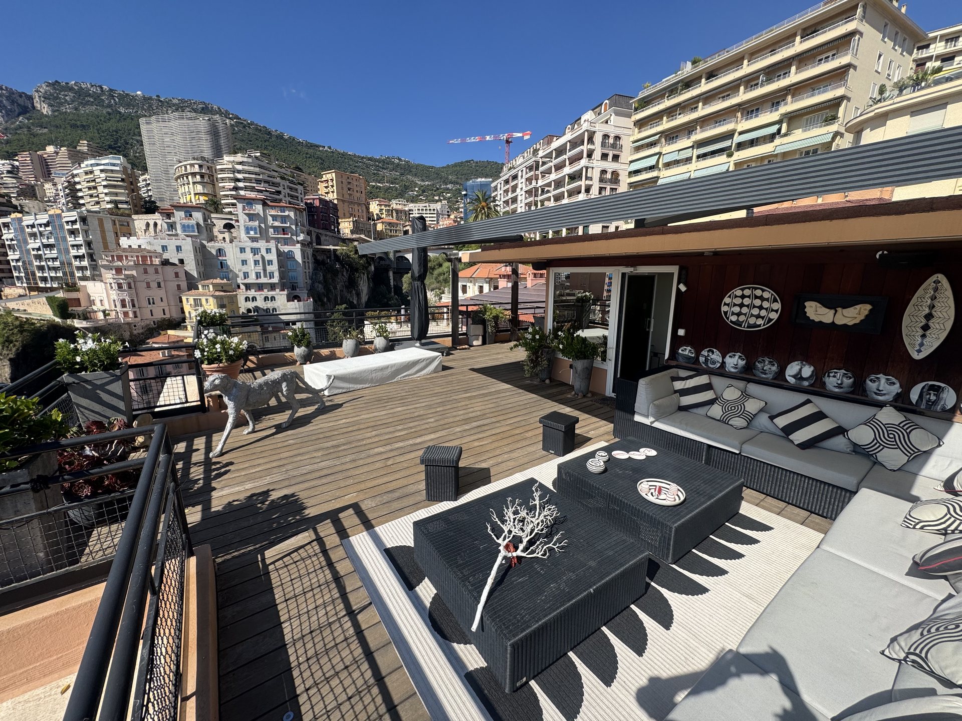 The rooftop terrace: the deck, the lounge and the city behind
